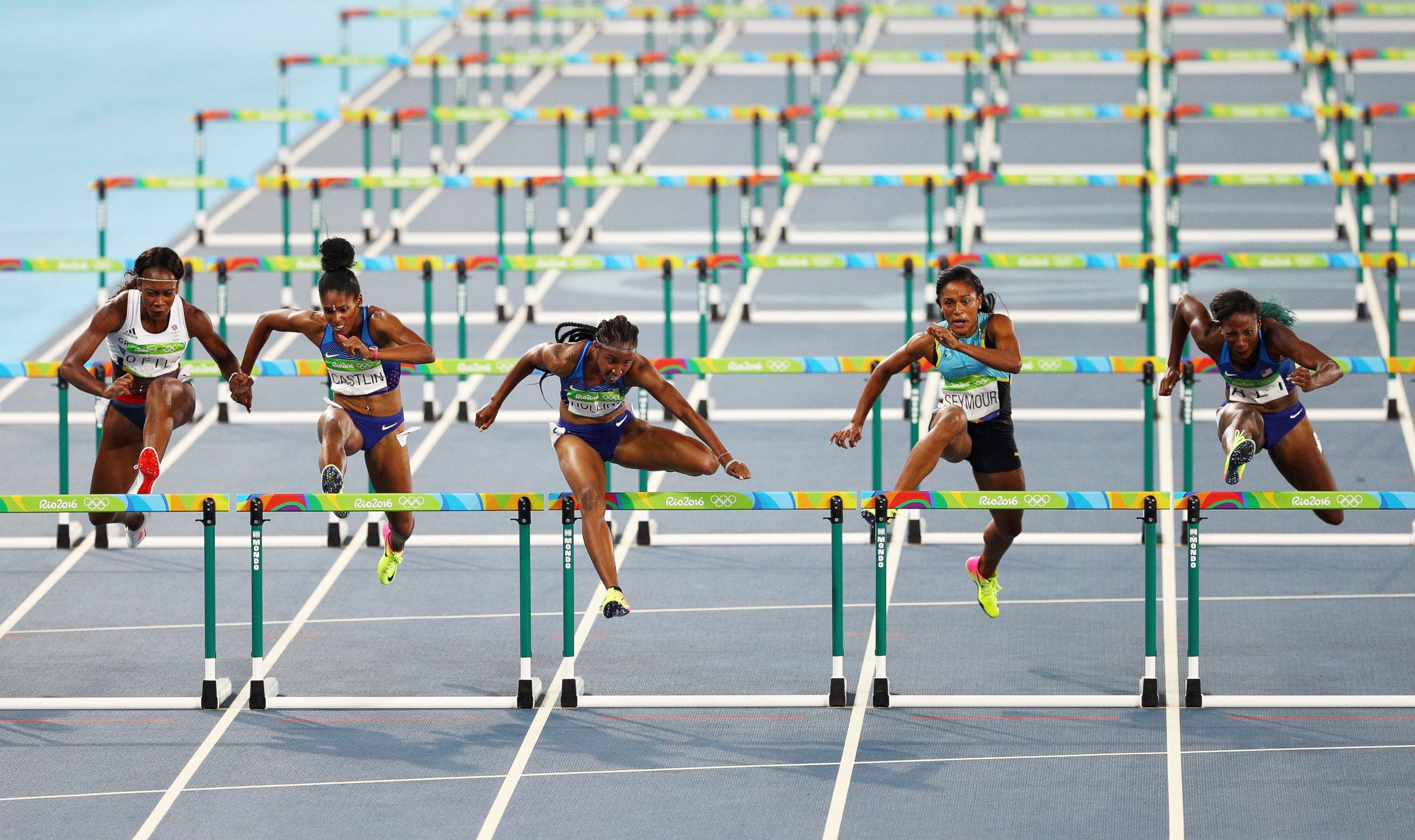 PHOTO: Brianna Rollins of the United States (C) competes on her way to winning the gold medal in the Women's 100m Hurdles Final ahead of silver medalist Nia Ali of the United States and bronze medalist Kristi Castlin of the United States