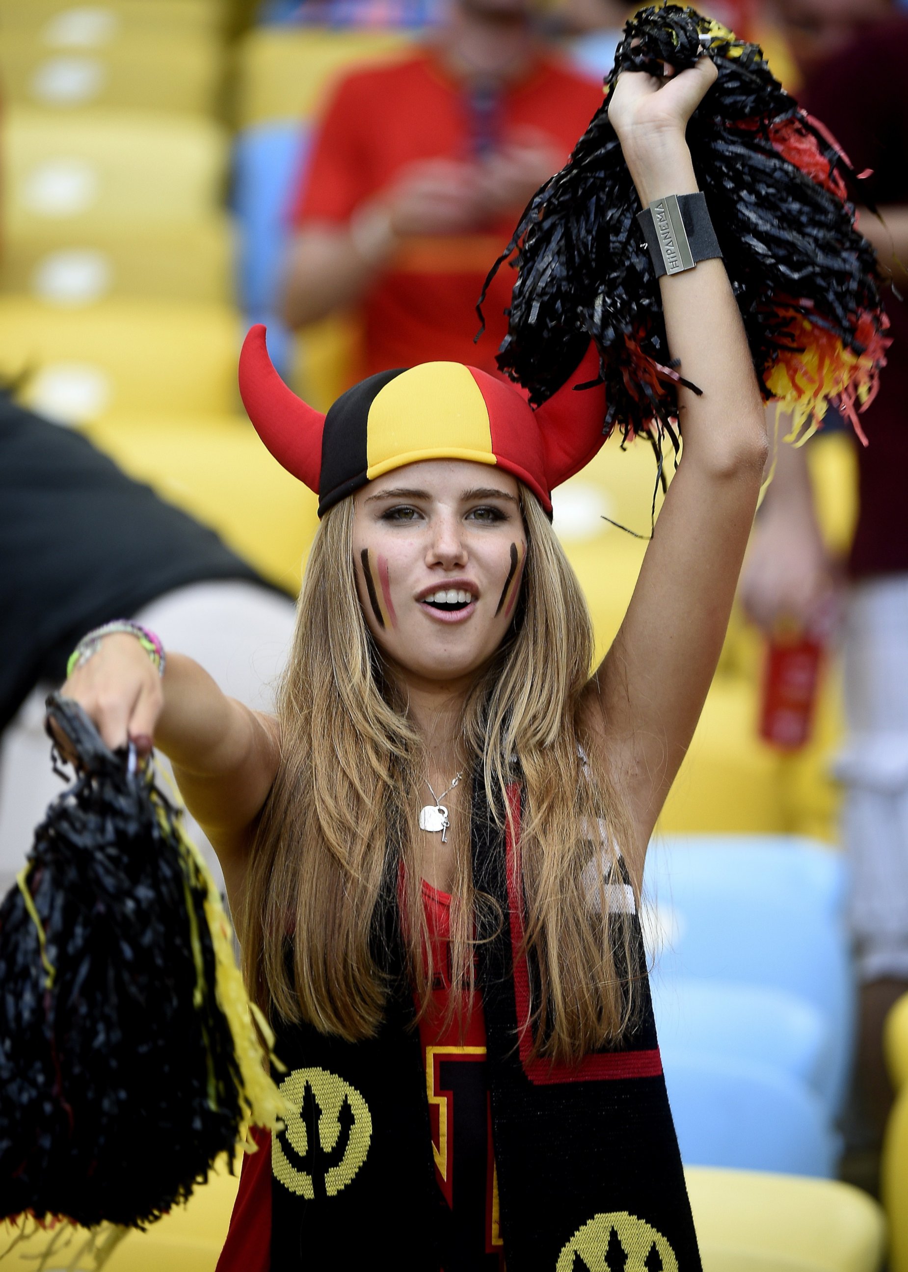 PHOTO: Axelle Despiegelaere, a Belgium fan poses as she waits for the start of the Group H football match between Belgium and Russia at the Maracana Stadium in Rio de Janeiro during the 2014 FIFA World Cup on June 22, 2014.
