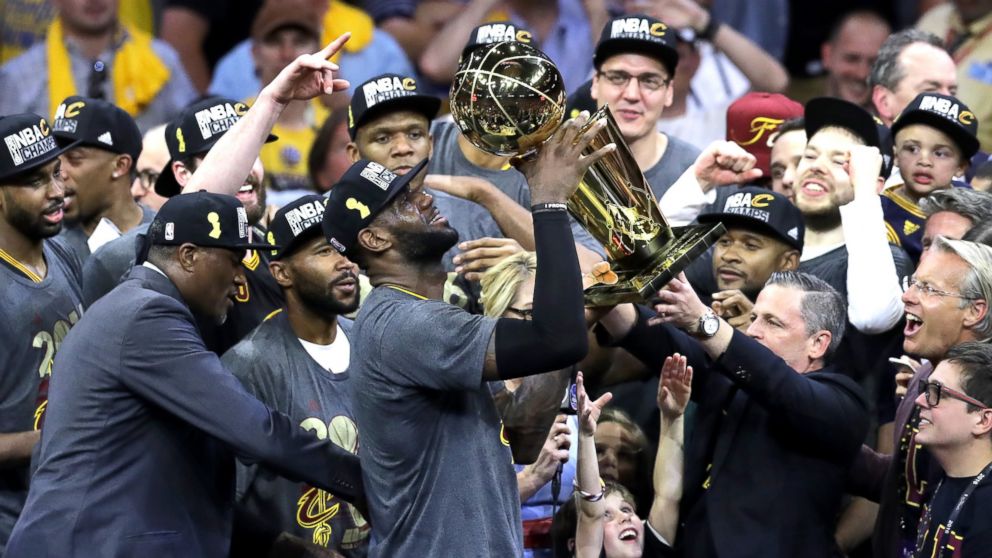 PHOTO: LeBron James of the Cleveland Cavaliers holds the Larry O'Brien Championship Trophy after defeating the Golden State Warriors 93-89 in Game 7 of the 2016 NBA Finals at Oracle Arena on June 19, 2016 in Oakland, Calif. 
