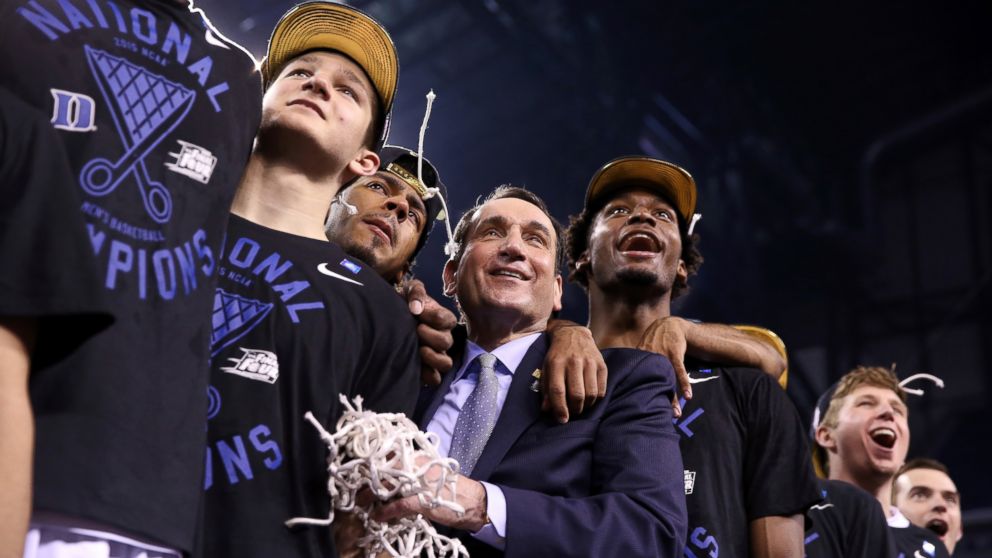 Head coach Mike Krzyzewski of the Duke Blue Devils watches "One Shining Moment" with his players Grayson Allen #3, Quinn Cook and Justise Winslow #12 after defeating the Wisconsin Badgers during the NCAA Men's Final Four National Championship at Lucas Oil Stadium on April 6, 2015 in Indianapolis, Indiana.
