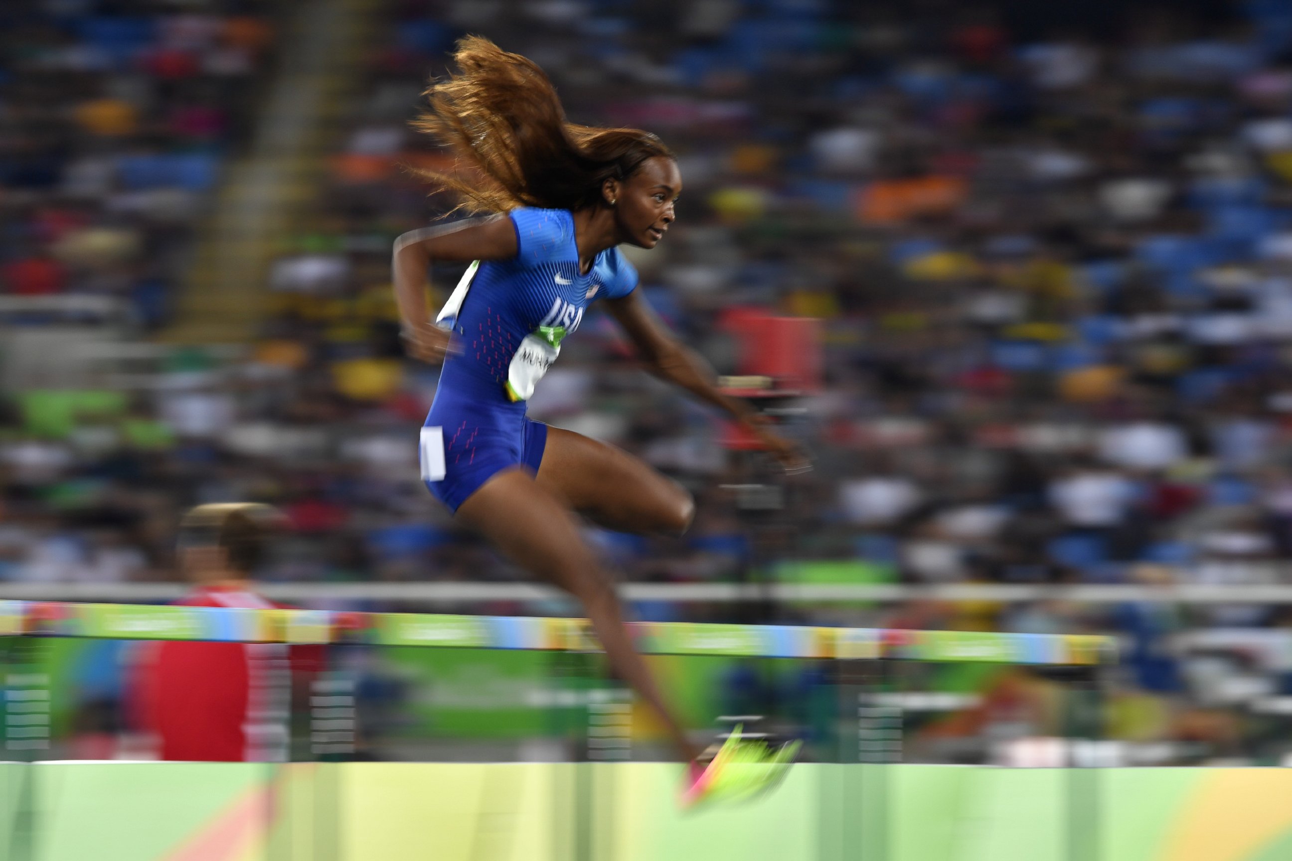 PHOTO: USA's Dalilah Muhammad competes in the Women's 400m Hurdles Semifinal during the athletics event at the Rio 2016 Olympic Games at the Olympic Stadium, on Aug. 16, 2016, in Rio de Janeiro.