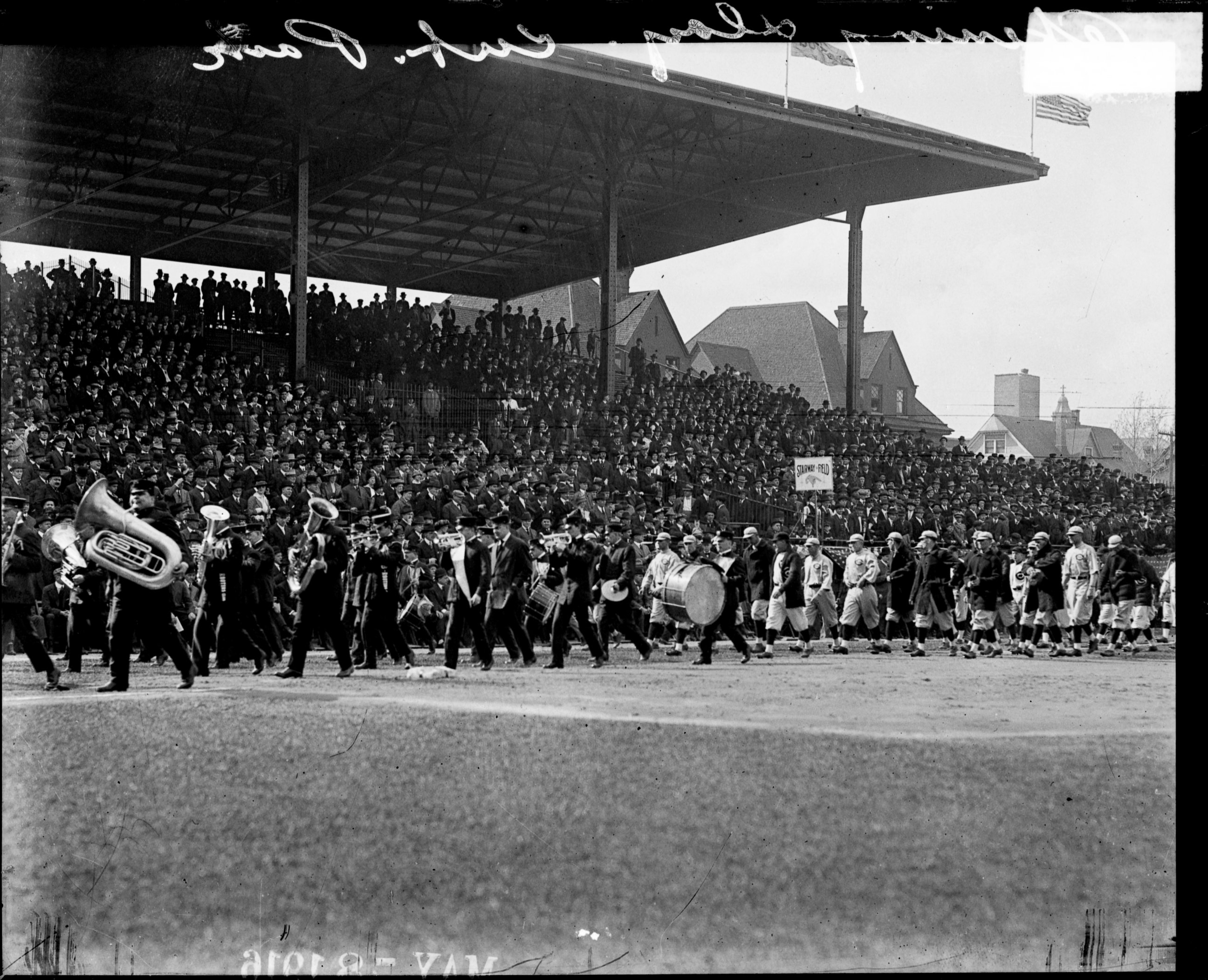 PHOTO: Chicago Cubs baseball team following a marching band at Weeghman Park on opening day in 1916, Chicago, ILL.  Weeghman Park was renamed Wrigley Field in 1927. 