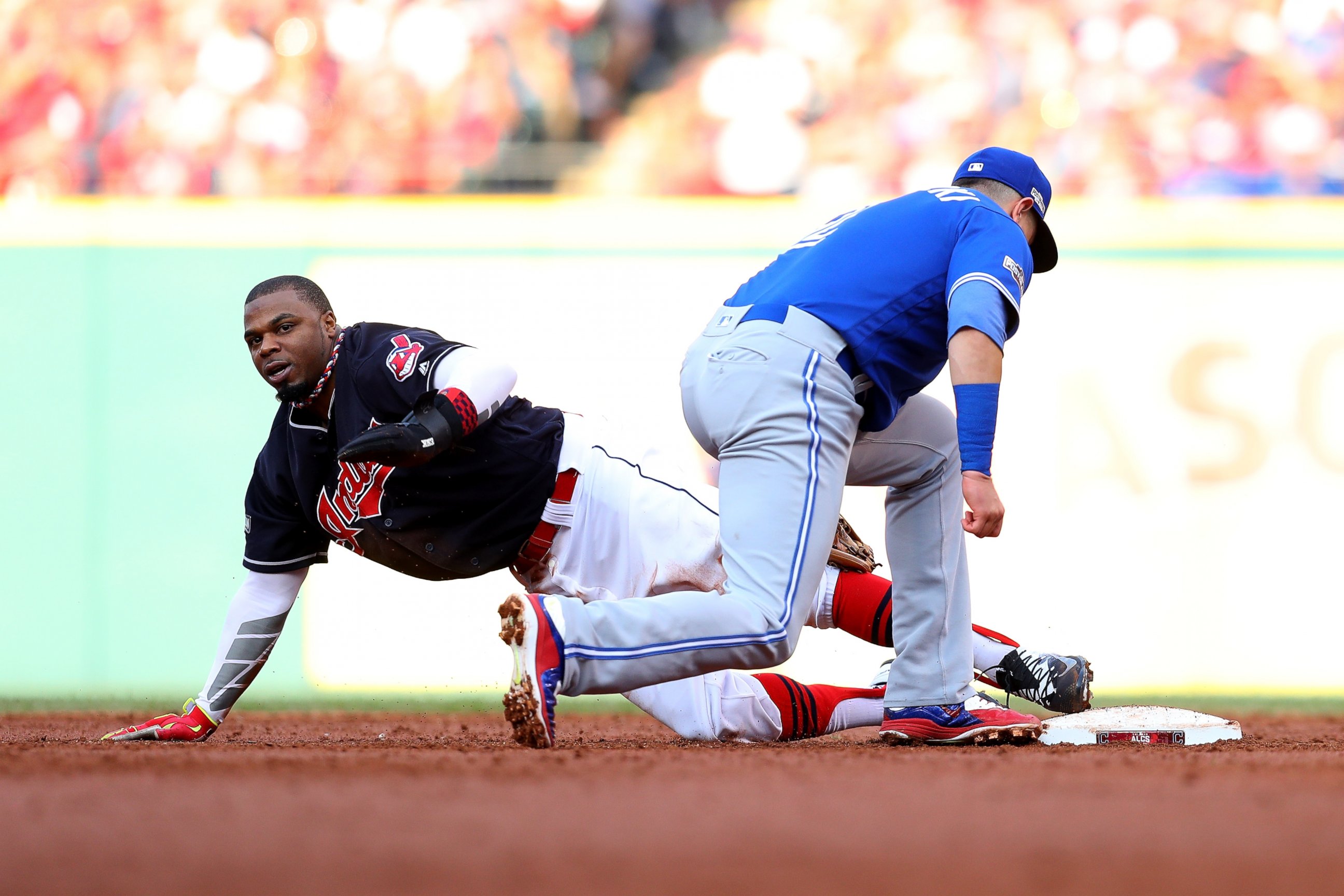 PHOTO: Rajai Davis of the Cleveland Indians steals second base in the third inning against the Toronto Blue Jays during game two of the American League Championship Series at Progressive Field on October 15, 2016 in Cleveland, OH.