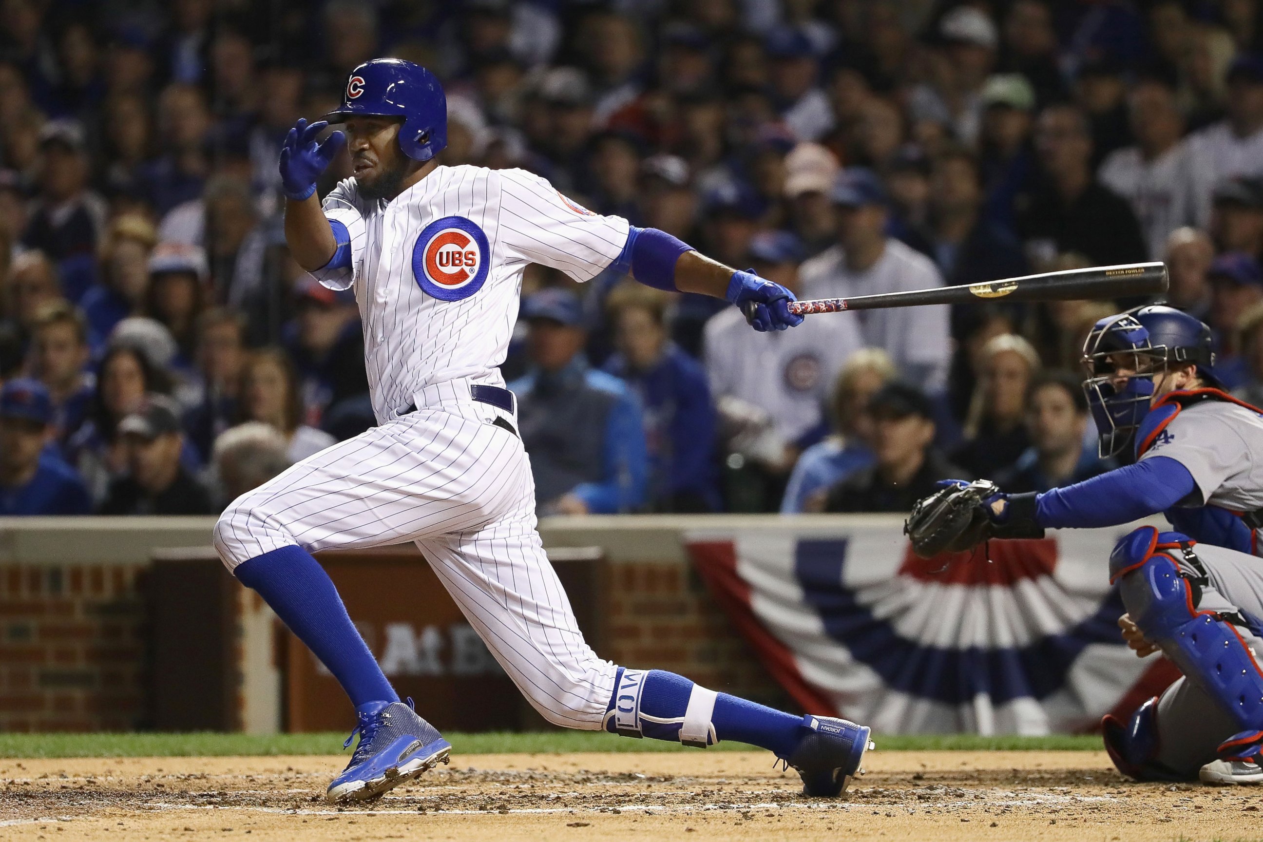 PHOTO: Dexter Fowler of the Chicago Cubs hits an RBI single in the second inning against the Los Angeles Dodgers during game six of the National League Championship Series at Wrigley Field on October 22, 2016 in Chicago, Ill. 