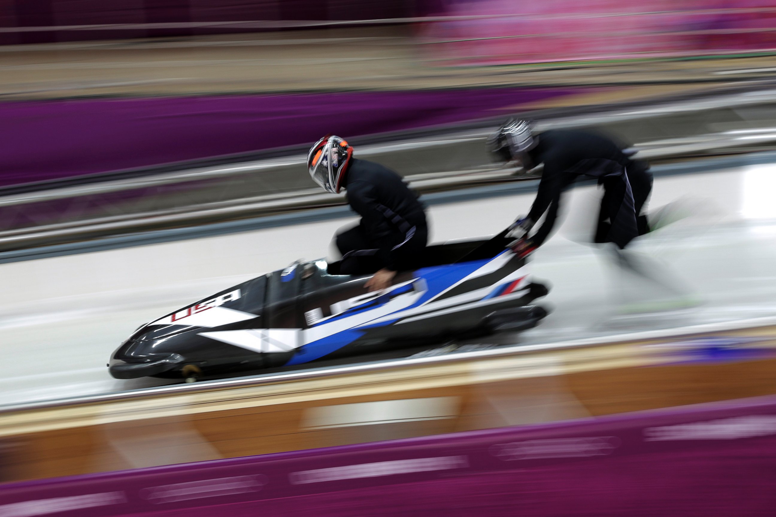 PHOTO: Members of the United States bobsleigh team practice ahead of the Sochi 2014 Winter Olympics at the Sanki Sliding Center, Feb. 6, 2014, in Sochi, Russia.  
