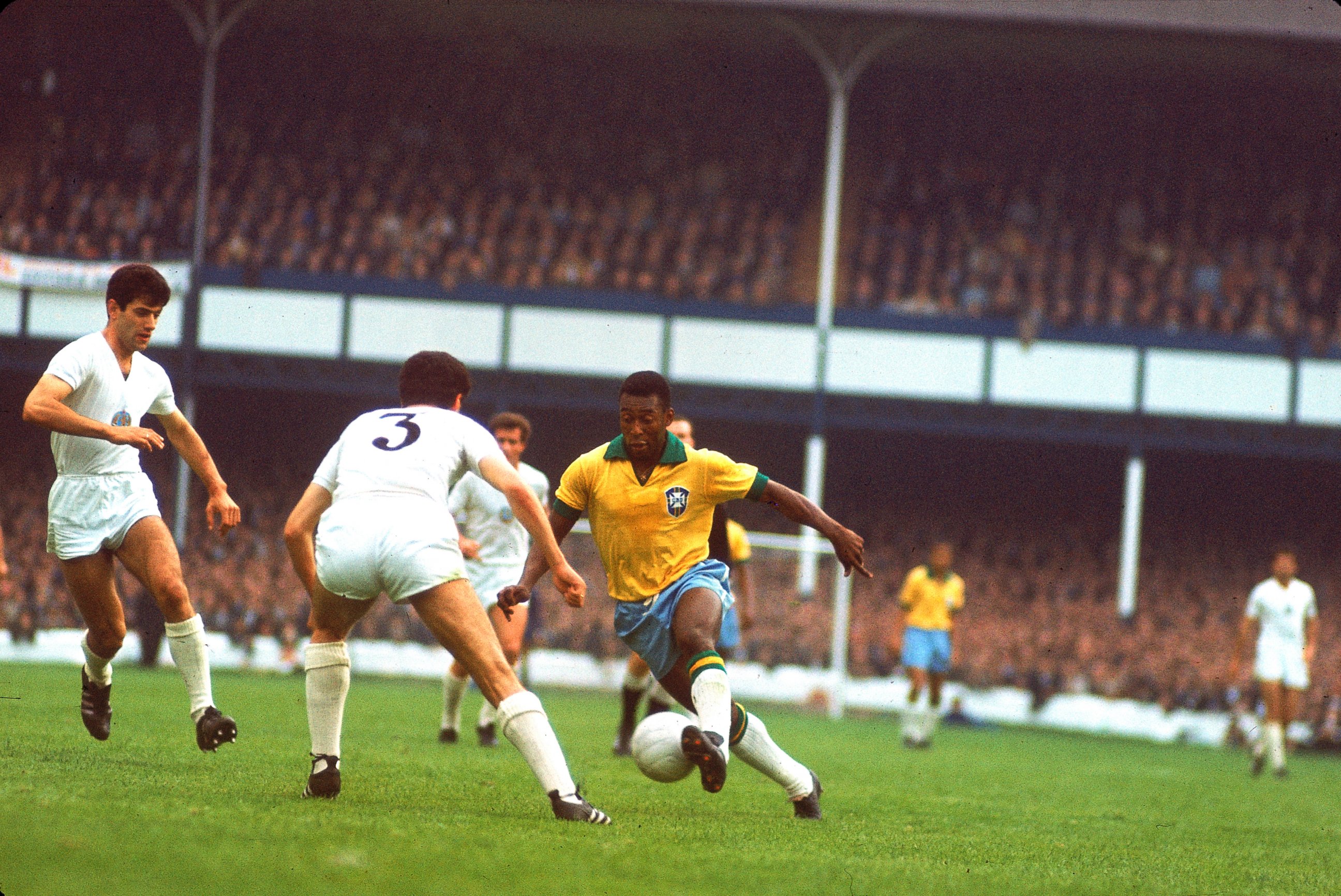 PHOTO: Brazilian soccer (football) star Pele (center, in yellow jersey) controls the ball for Brazil at Goodison Park during a match against Hungary in the 1966 World Cup tournament, Liverpool, England, in this July 15, 1966, file photo.