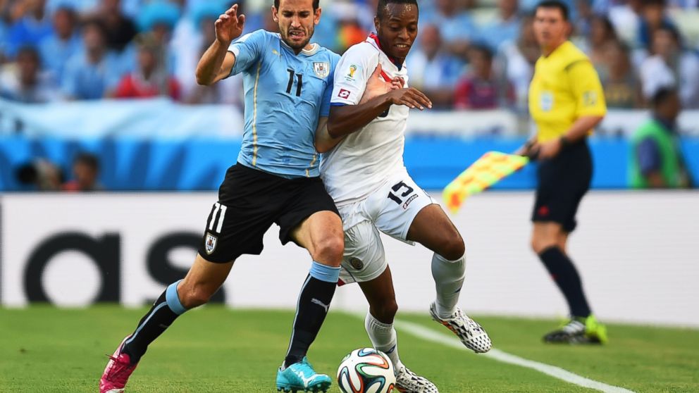 Junior Diaz of Costa Rica is challenged by Christian Stuani of Uruguay during the 2014 FIFA World Cup Brazil Group D match between Uruguay and Costa Rica at Castelao on June 14, 2014 in Fortaleza, Brazil. 