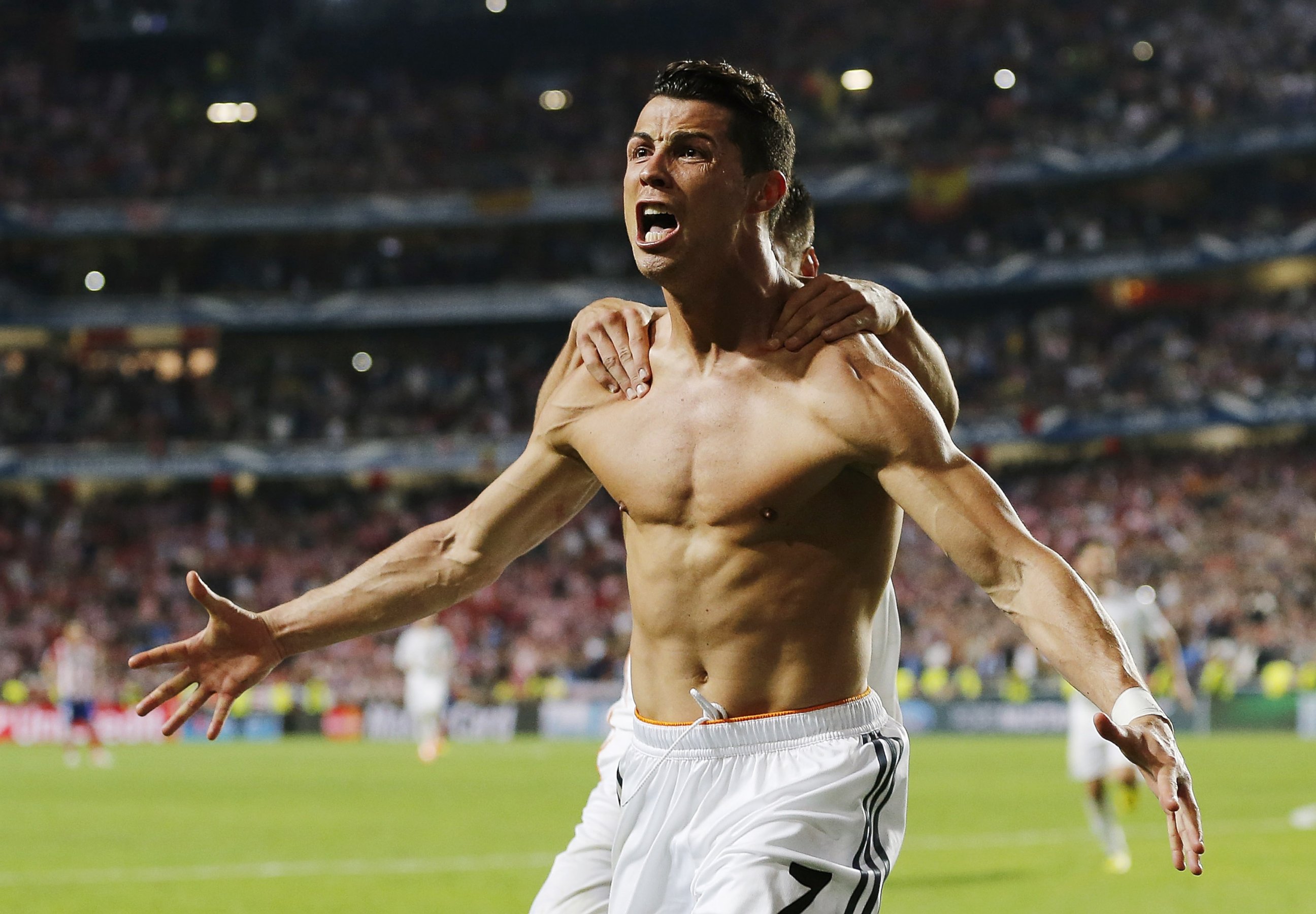 PHOTO: Cristiano Ronaldo of Real Madrid celebrates scoring their fourth goal from the penalty spot during the UEFA Champions League Final between Real Madrid and Atletico de Madrid at Estadio da Luz, May 24, 2014 in Lisbon, Portugal.