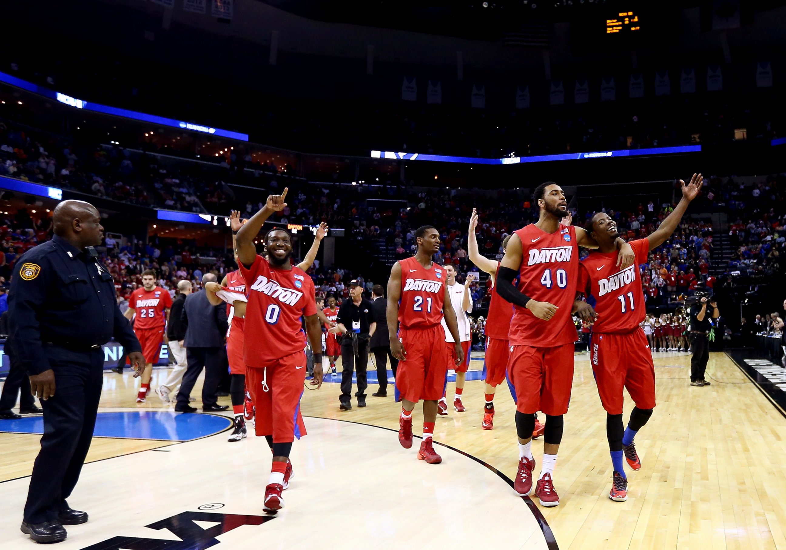 PHOTO: The Dayton Flyers walk off the floor after defeating the Stanford Cardinal in a regional semifinal of the 2014 NCAA Men's Basketball Tournament on March 27, 2014 in Memphis, Tenn. 