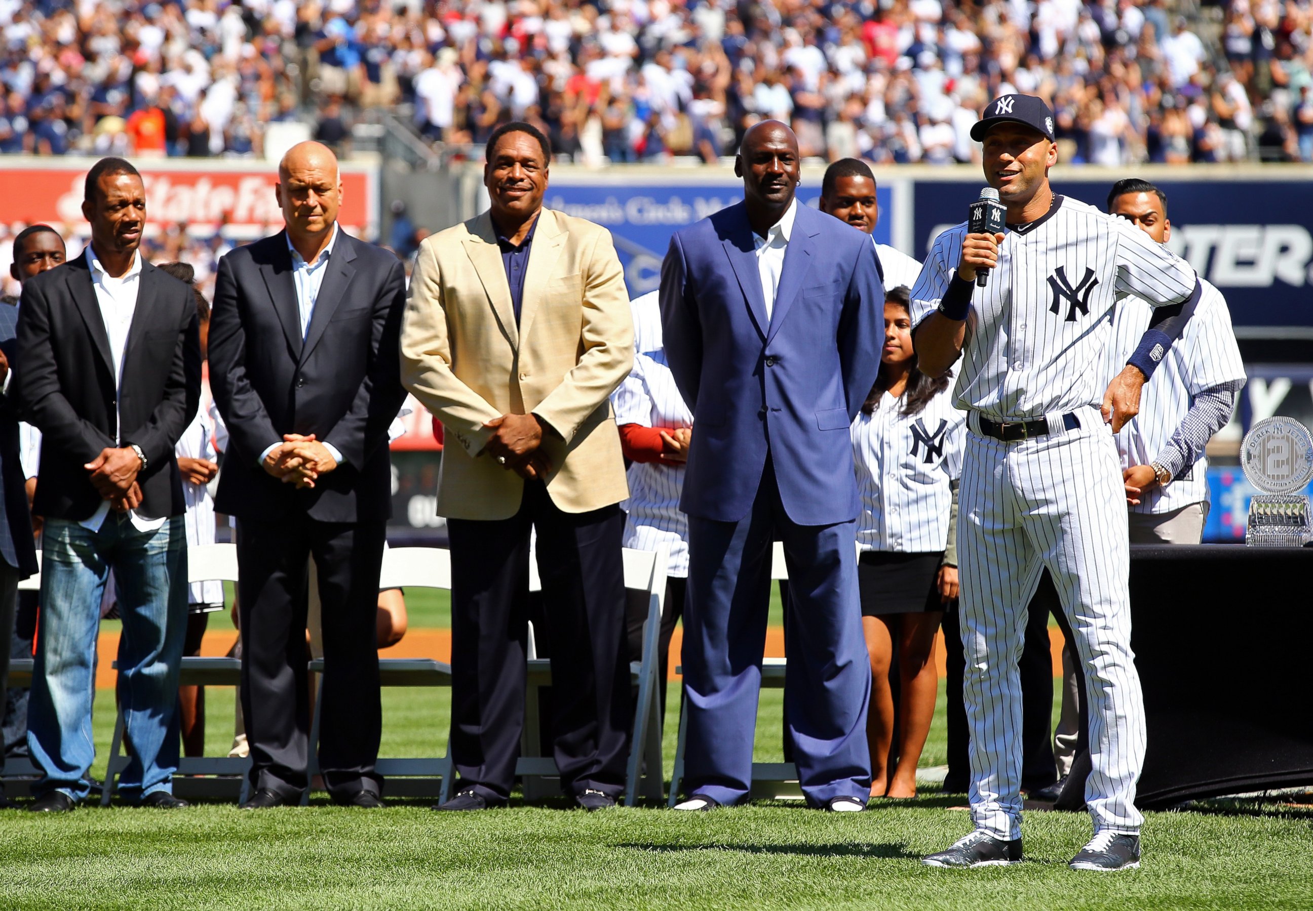 PHOTO: From right, Derek Jeter of the New York Yankees speaks to the crowd