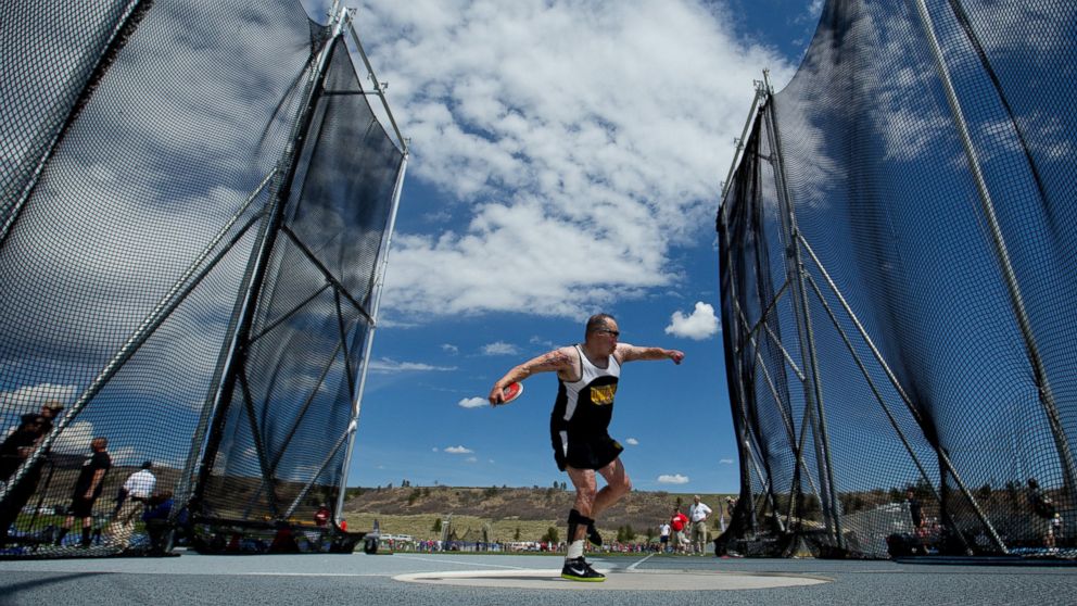 Israel Del Toro of the United States Special Operations Command competes in the standing discus during the Warrior Games, May 14, 2013, at Air Force Academy in Colorado.
