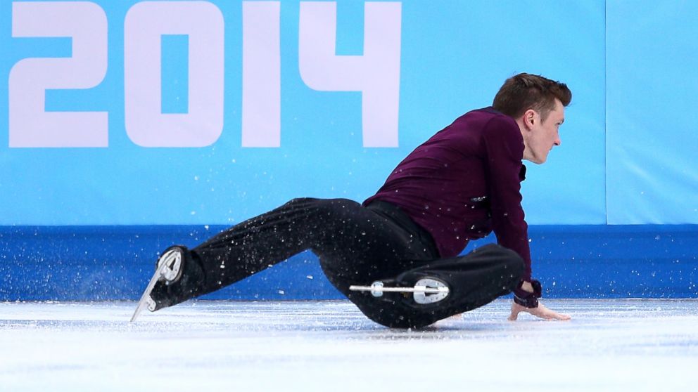 Jeremy Abbott of the United States falls while competing in the Figure Skating Men's Short Program during the Sochi 2014 Winter Olympics in Sochi, Russia, Feb. 6, 2014.