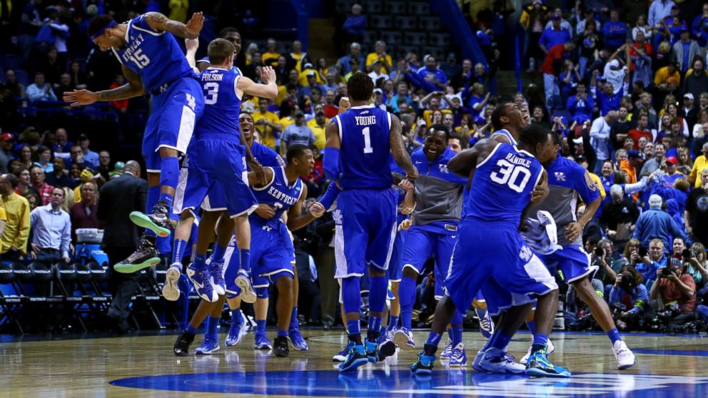 The Kentucky Wildcats celebrate defeating the Wichita State Shockers 78 to 76 during the third round of the 2014 NCAA Men's Basketball Tournament at Scottrade Center on March 23, 2014 in St Louis. 