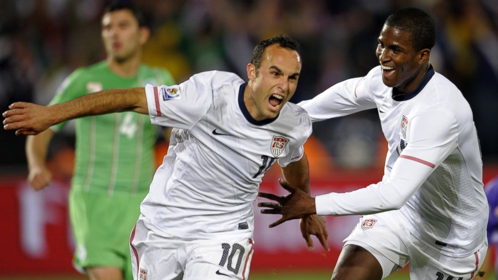 US midfielder Landon Donovan celebrates his goal with teammate striker Edson Buddle during the Group C, first round, 2010 World Cup football match USA vs. Algeria, June 23, 2010.