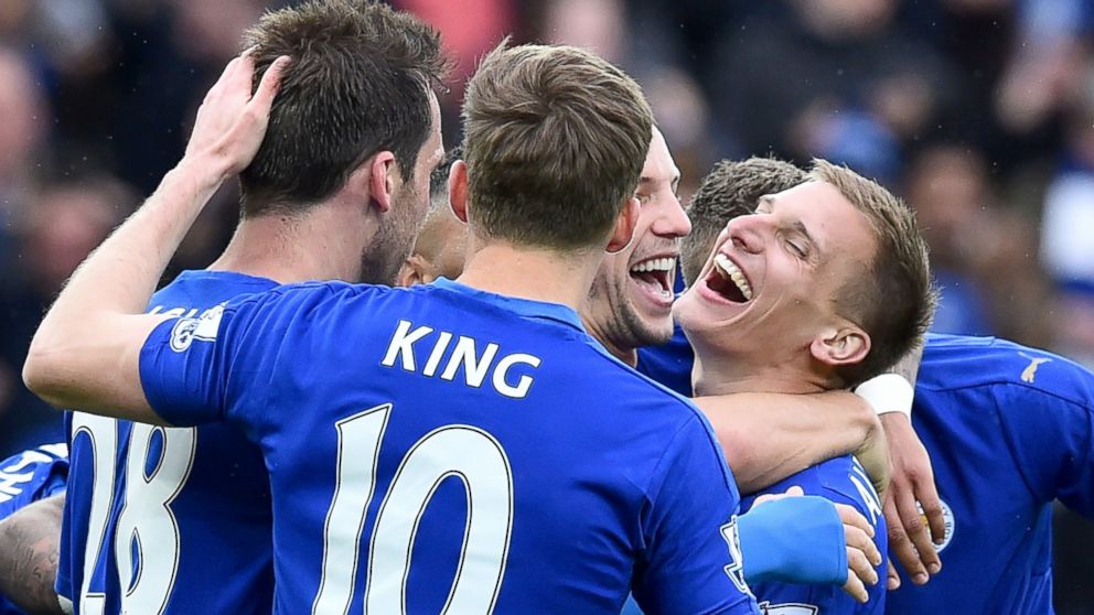 Leicester City's English midfielder Marc Albrighton (R) celebrates scoring their fourth goal during the English Premier League football match between Leicester City and Swansea at King Power Stadium in Leicester, England, April 24, 2016. 