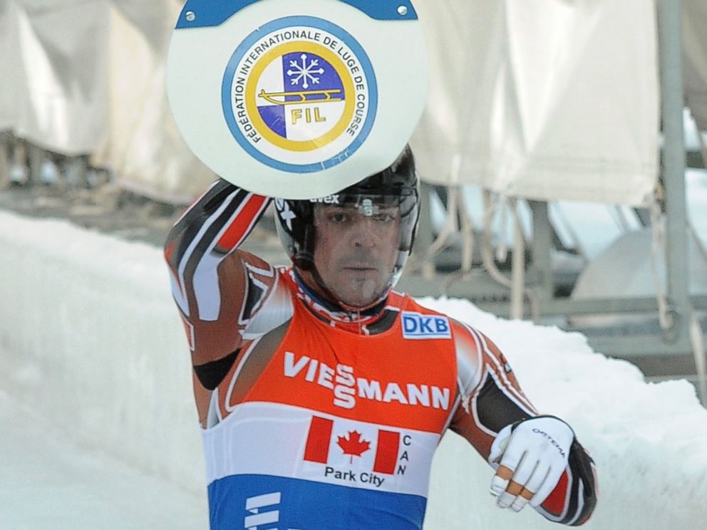 PHOTO: Samuel Edney of Canada hits the touch pad during the Team Relay competition on day 2 of the Viessmann Luge World Cup event at Utah Olympic Park, Dec. 14, 2013, in Park City, Utah.