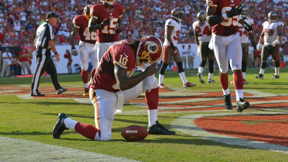 PHOTO: Washington Redskins quarterback Robert Griffin III (10) kneels down after scoring a rushing touchdown against Tampa Bay in the second quarter of Washington's 24-22 win at Raymond James Stadium, Sept. 30, 2012, in Tampa Bay, Fla.