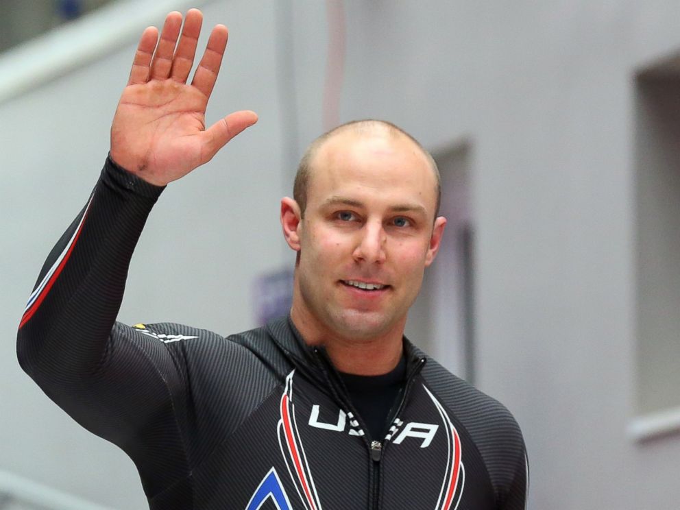 PHOTO: Nick Cunningham of the U.S. team 3 waves to the crowd as he finishes a run during the mens two-man bobsleigh during the 2014 Sochi Winter Olympics on Feb. 17, 2014 in Sochi, Russia.