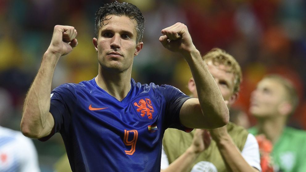 PHOTO: Netherlands' forward Robin van Persie celebrates at the end of a Group B football match between Spain and the Netherlands at the Fonte Nova Arena in Salvador during the 2014 FIFA World Cup on June 13, 2014.