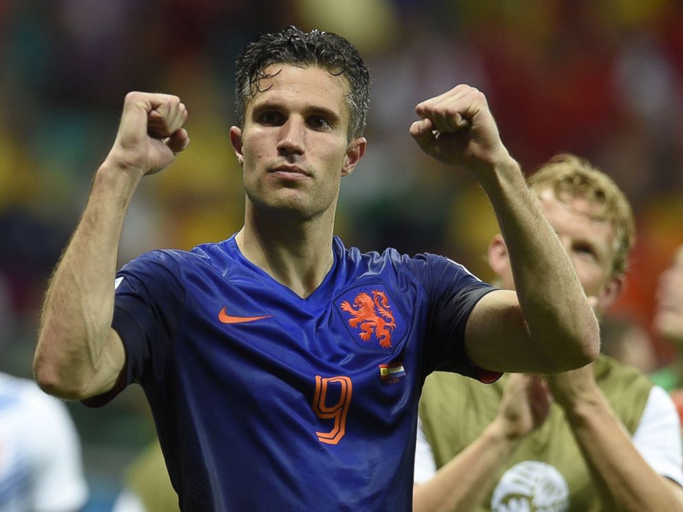PHOTO: Netherlands forward Robin van Persie celebrates at the end of a Group B football match between Spain and the Netherlands at the Fonte Nova Arena in Salvador during the 2014 FIFA World Cup on June 13, 2014.