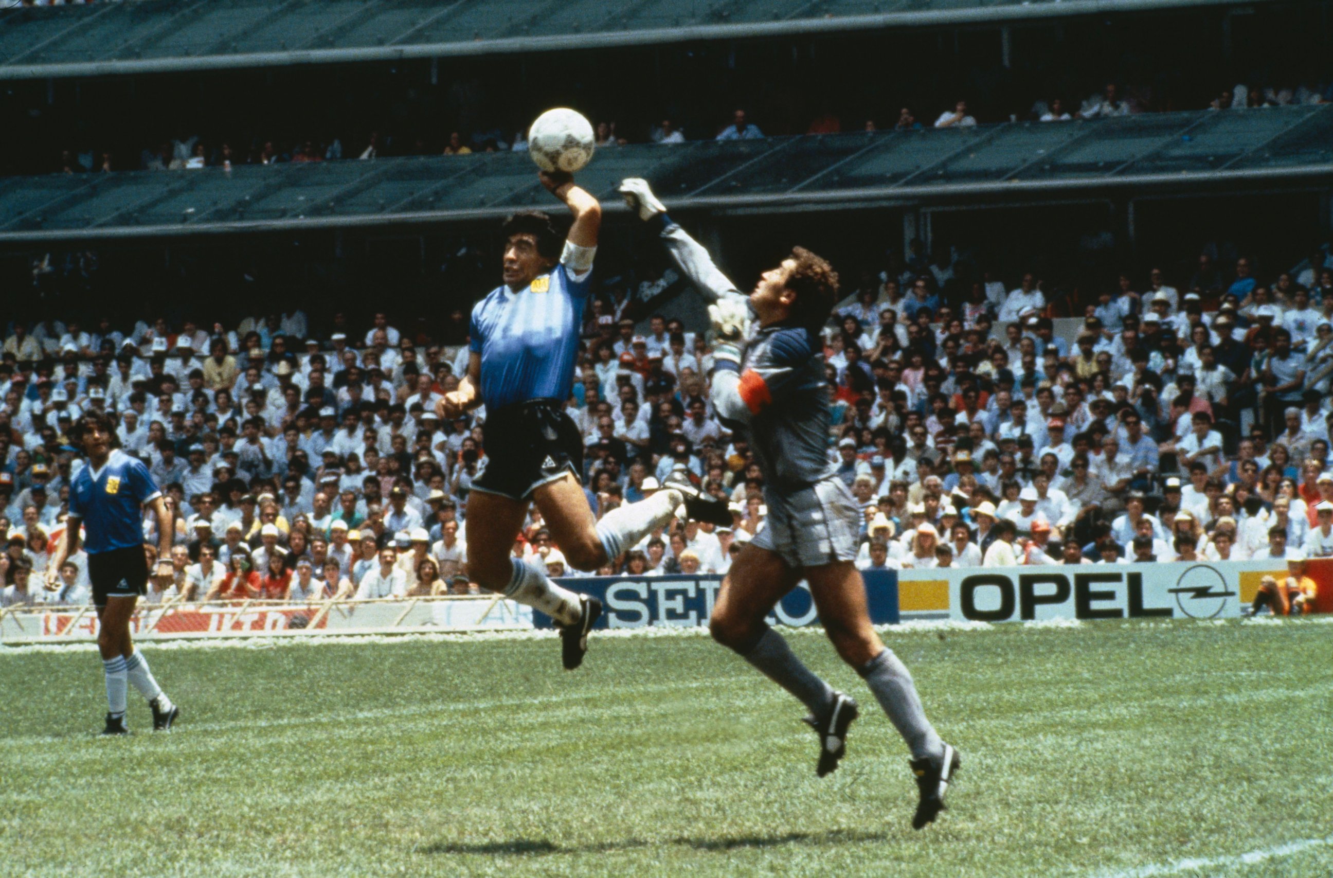 PHOTO: Argentina's Diego Maradona scores with his "Hand of God," past England goalkeeper Peter Shilton on June 22, 1986 in Mexico.