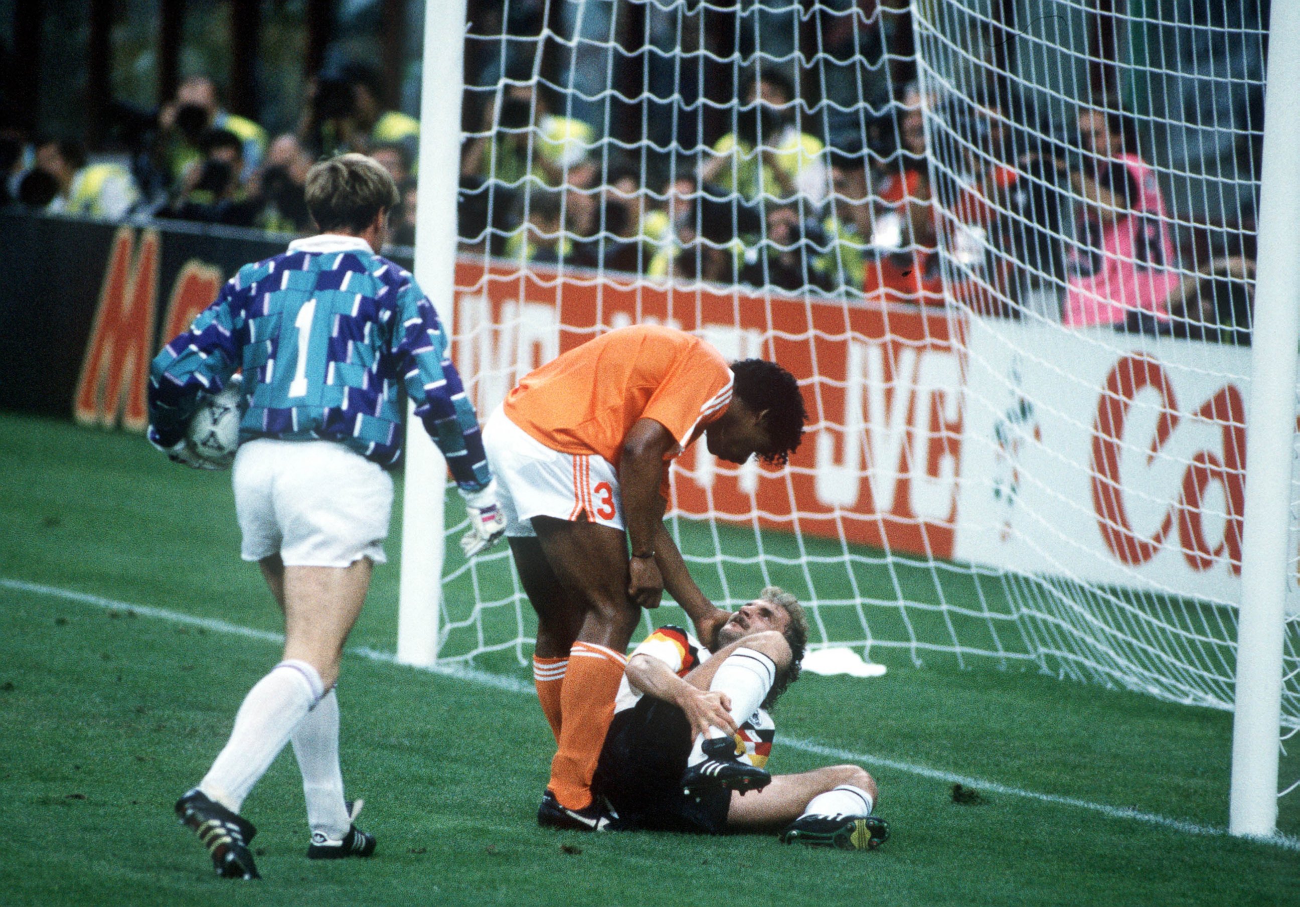 PHOTO: West Germany's Rudi Voeller, right, clashes with Holland's Frank Rijkaard, center, as Dutch goalkeeper Hans Van Breukelen, left, watches on June 24, 1990 in Milan, Italy. Rijkaard later spat on Voeller as they left the field after being sent off.