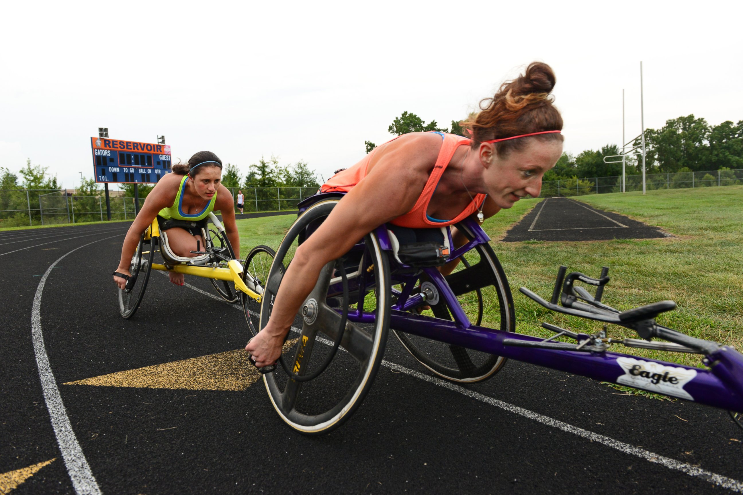 PHOTO: Wheelchair racers Hannah McFadden, left, and sister Tatyana McFadden train together at a local high school in Clarksville, Md,  Aug. 21, 2013. 