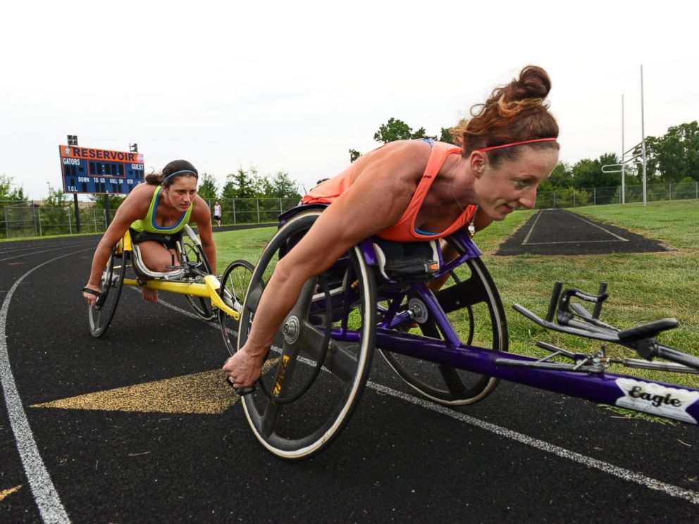 PHOTO: Wheelchair racers Hannah McFadden, left, and sister Tatyana McFadden train together at a local high school in Clarksville, Md, Aug. 21, 2013.