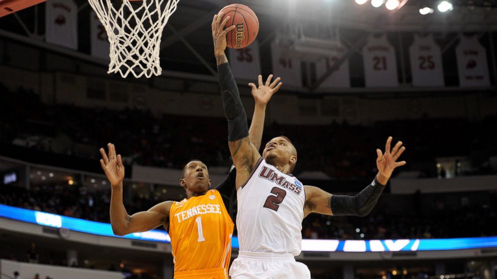 Derrick Gordon, right, of the Massachusetts Minutemen goes up for a shot against Josh Richardson of the Tennessee Volunteers in the second round of the 2014 NCAA Men's Basketball Tournament at PNC Arena on March 21, 2014. 