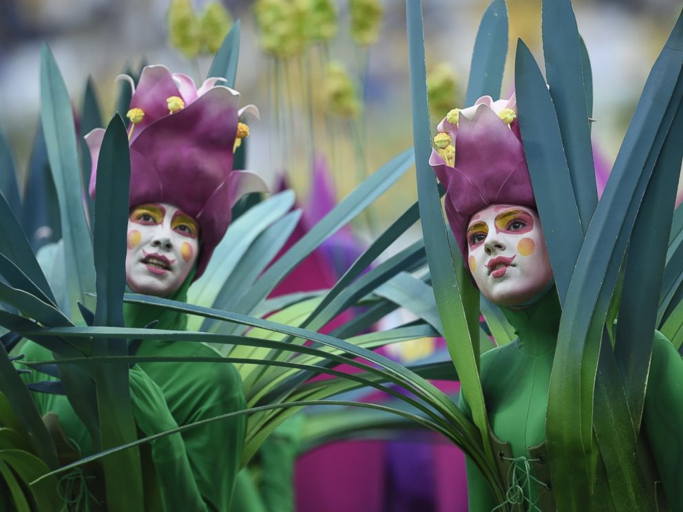 PHOTO: People dressed as flowers take part in the opening ceremony of the 2014 FIFA football World Cup at the Corinthians Arena in Sao Paulo on June 12, 2014.