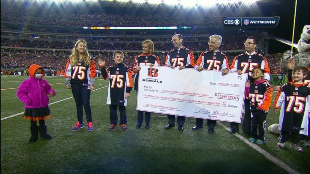 Leah Still, 4, participates in a ceremony during her father's NFL game in Cincinnati, Ohio, on November 6, 2014. The Cincinnati Bengals donated all the proceeds from Devon Still's jersey sales to the Cincinnati Children's Hospital Medical Center. 