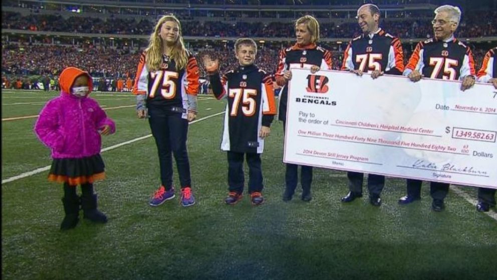 Leah Still, 4, participates in a ceremony during her father's NFL game in Cincinnati, Ohio, on November 6, 2014. The Cincinnati Bengals donated all the proceeds from Devon Still's jersey sales to the Cincinnati Children's Hospital Medical Center. 