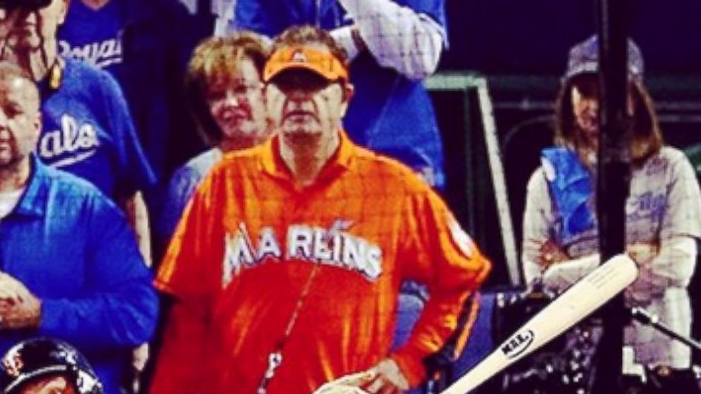 Laurence Leavy, known as "Marlins Man," watches Game 1 of the 2014 World Series, Oct. 21, 2014 in Kansas City, Mo.