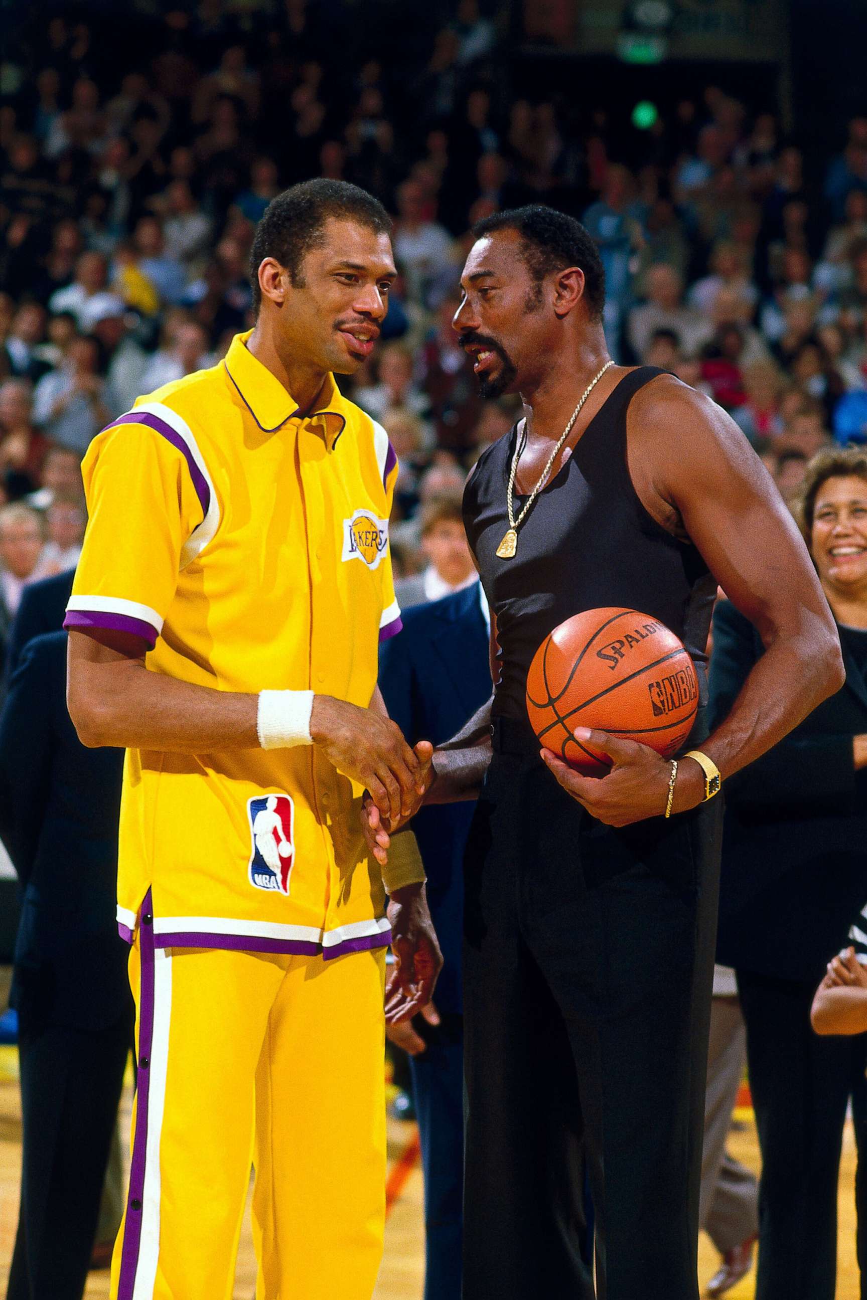 PHOTO: Kareem Abdul Jabbar of the LA Lakers talks with Wilt Chamberlain on the court prior to playing an NBA game against the Kansas City Kings on April 6, 1984 at the Forum in Inglewood, California.