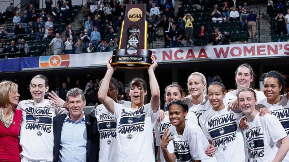 The Connecticut Huskies celebrate with the trophy after their 82-51 victory over the Syracuse Orange to win the championship game of the 2016 NCAA Women's Final Four Basketball Championship at Bankers Life Fieldhouse on April 5, 2016 in Indianapolis, Indiana. 
