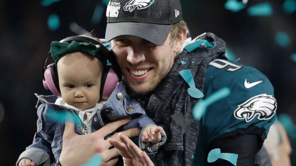 PHOTO: Philadelphia Eagles' Nick Foles holds up his daughter, Lily after the NFL Super Bowl 52 football game against the New England Patriots, Feb. 4, 2018, in Minneapolis. 