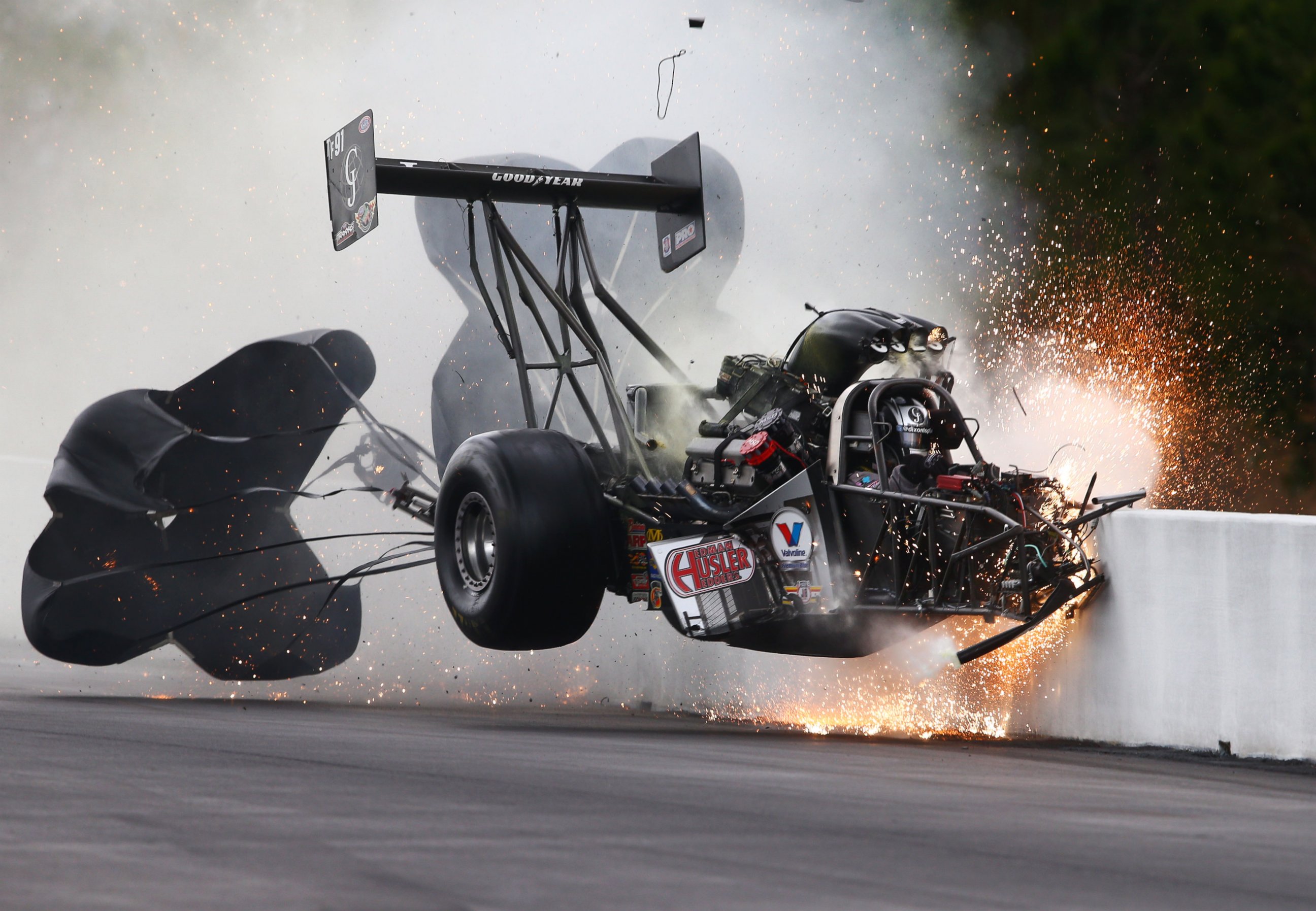 PHOTO: Larry Dixon's Top Fuel car breaks in half at about 280 mph and flies through the air during qualifying for the Amalie Motor Oil NHRA Gatornationals at Auto-Plus Raceway in Gainesville, Fla., March 14, 2015.