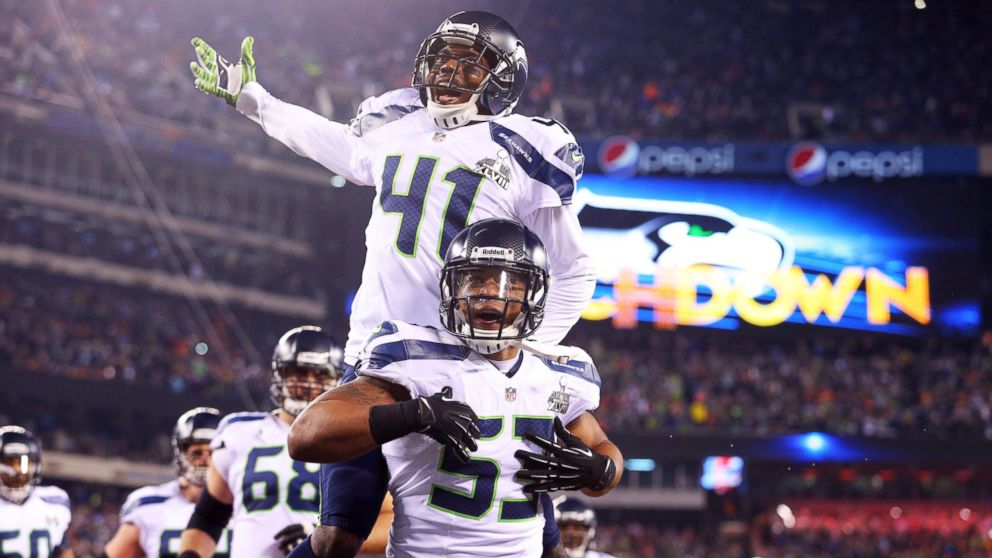 Seattle Seahawks outside linebacker Malcolm Smith (53) and cornerback Byron Maxwell (41) celebrate a touchdown during the first half against the Denver Broncos in Super Bowl XLVIII at MetLife Stadium, Feb. 2, 2014.