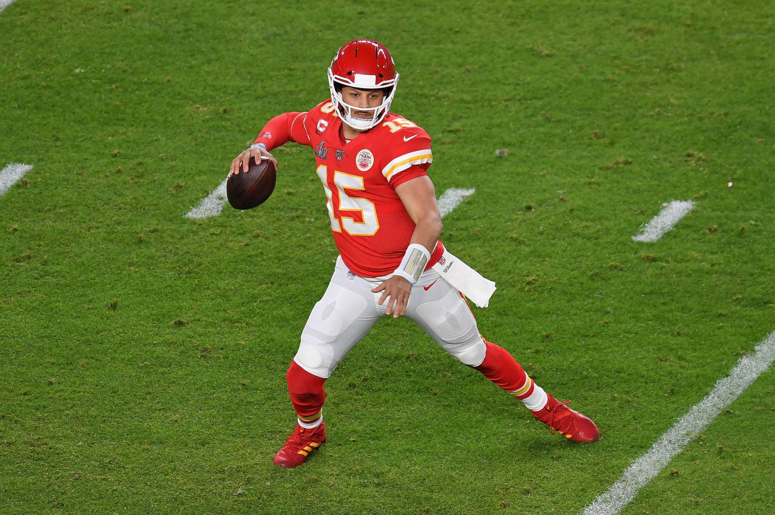 PHOTO: (FILES) In this file photo taken on February 2, 2020 Quarterback for the Kansas City Chiefs Patrick Mahomes carries the ball during Super Bowl LIV between the Kansas City Chiefs and the San Francisco 49ers at Hard Rock Stadium in Miami, Florida.