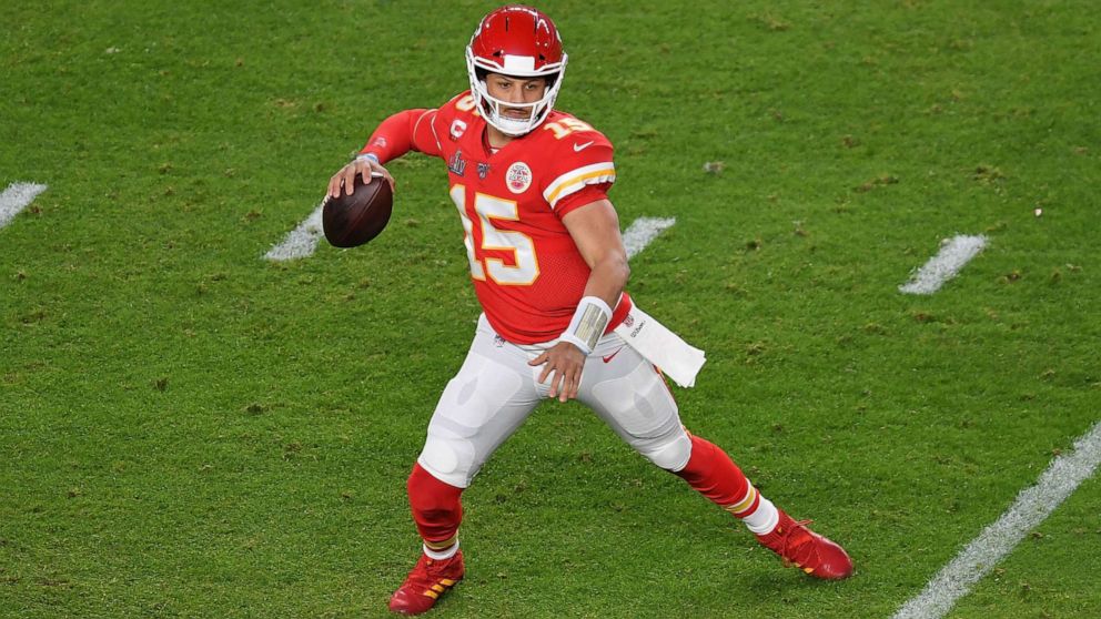 PHOTO: (FILES) In this file photo taken on February 2, 2020 Quarterback for the Kansas City Chiefs Patrick Mahomes carries the ball during Super Bowl LIV between the Kansas City Chiefs and the San Francisco 49ers at Hard Rock Stadium in Miami, Florida.