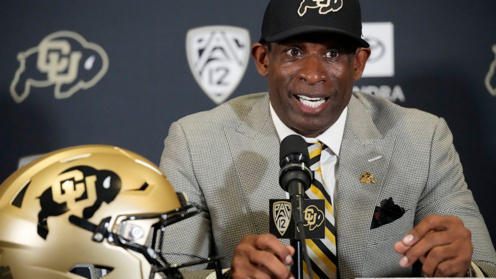 Deion Sanders speaks after being introduced as the new head NCAA college football coach at Colorado during a news conference Sunday, Dec. 4, 2022, in Boulder, Colo. (AP Photo/David Zalubowski)