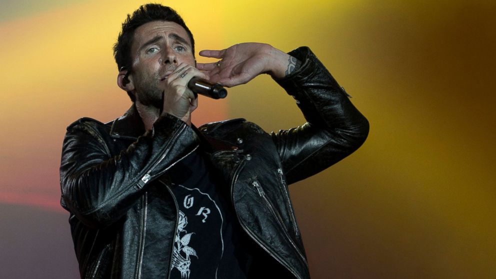 FILE - In this Sept. 16, 2017, file photo, Adam Levine of Maroon 5 performs at the Rock in Rio music festival in Rio de Janeiro, Brazil. Big Boi and Travis Scott will join Maroon 5 in this year’s Super Bowl halftime show. Maroon 5 had been the widely