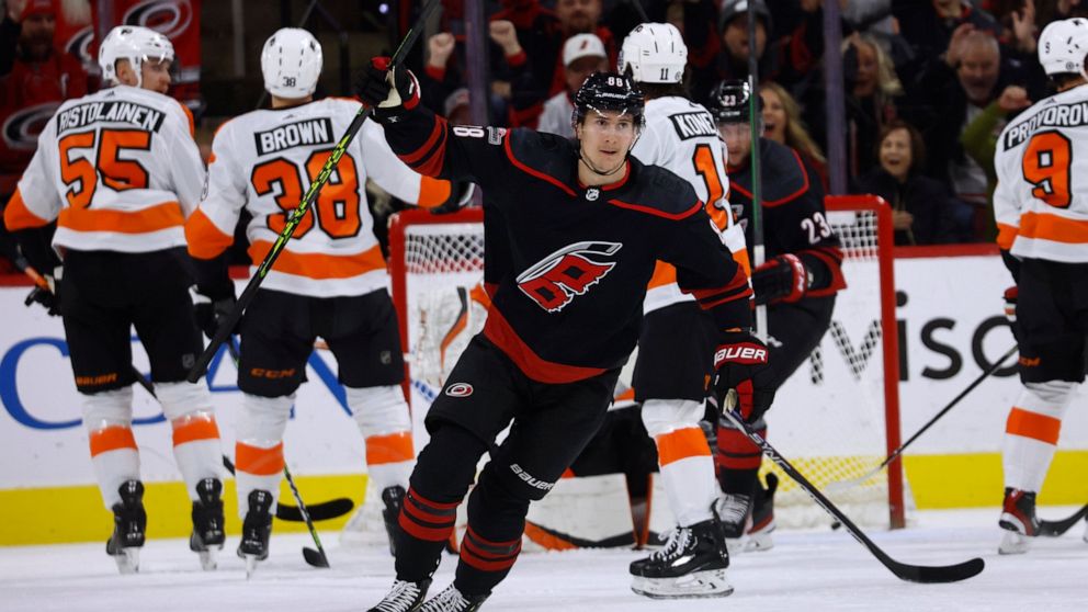 Carolina Hurricanes' Martin Necas (88) celebrates his goal against the Philadelphia Flyers during the first period of an NHL hockey game in Raleigh, N.C., Friday, Dec. 23, 2022. (AP Photo/Karl B DeBlaker)