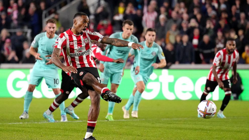 Brentford's Ivan Toney scores against Brighton and Hove Albion during the English Premier League soccer match at the Gtech Community Stadium, London, Friday Oct. 14, 2022. (John Walton/PA via AP)