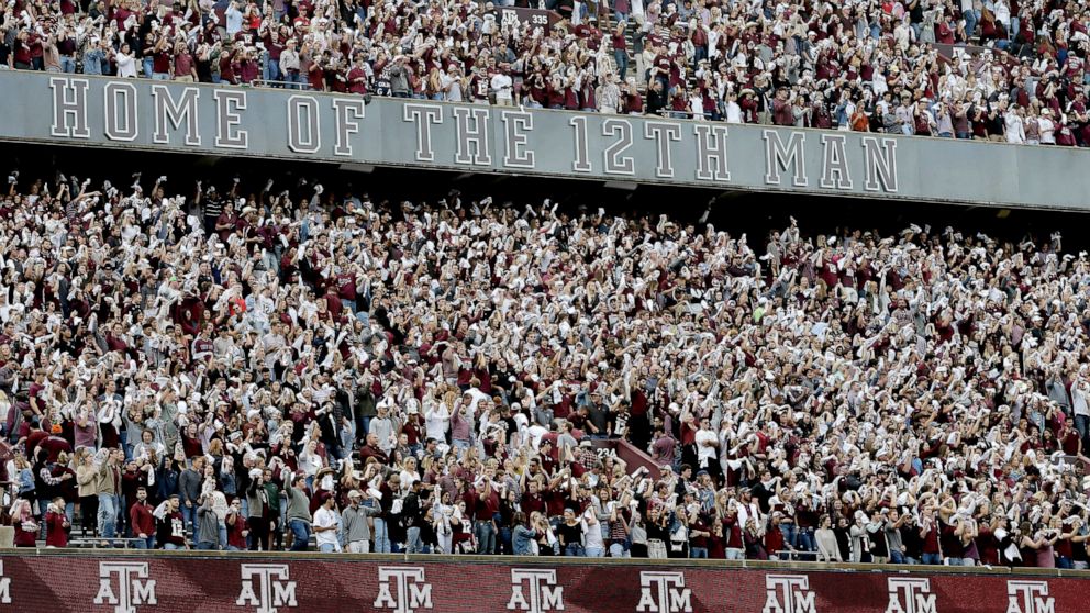 FILE - In this Oct. 12, 2019, file photo, the Texas A&M student section cheers before the team's NCAA college football game against Alabama in College Station, Texas. Defending champion Alabama faces a tough road test at Texas A&M on Oct. 9. The Aggi