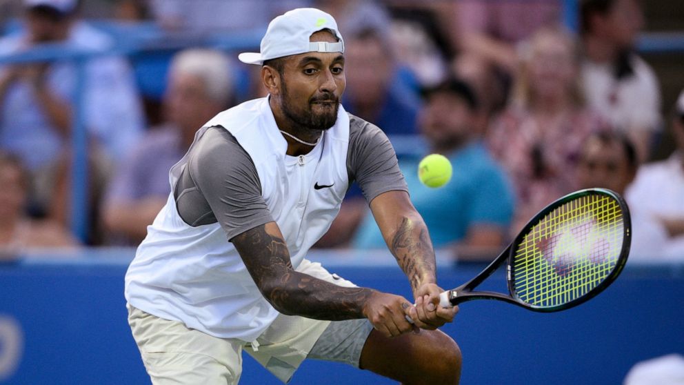 Nick Kyrgios, of Australia, hits a return to Mikael Ymer, of Sweden, during a semifinal at the Citi Open tennis tournament Saturday, Aug. 6, 2022, in Washington. (AP Photo/Nick Wass)