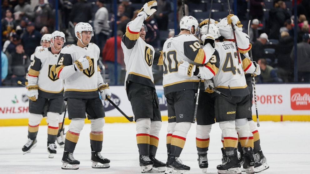 Vegas Golden Knights players celebrate after their win over the Columbus Blue Jackets in an NHL hockey game on Monday, Nov. 28, 2022, in Columbus, Ohio. (AP Photo/Jay LaPrete)