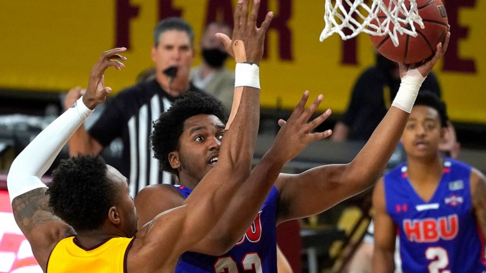FILE - Houston Baptist guard Darius Lee (23) during the first half of an NCAA college basketball game against Arizona State, Nov. 29, 2020, in Tempe, Ariz. Lee was killed and eight other people were wounded Monday, June 20, 2022 in an early-morning s