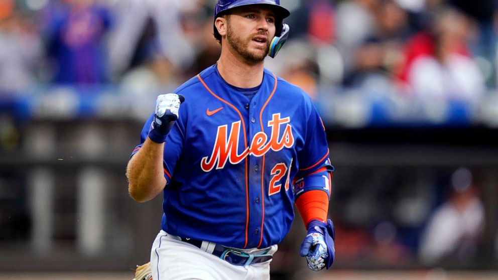 New York Mets' Pete Alonso gestures as he runs to first base for an RBI single during the second inning in the first baseball game of a doubleheader against the Atlanta Braves, Tuesday, May 3, 2022, in New York. (AP Photo/Frank Franklin II)