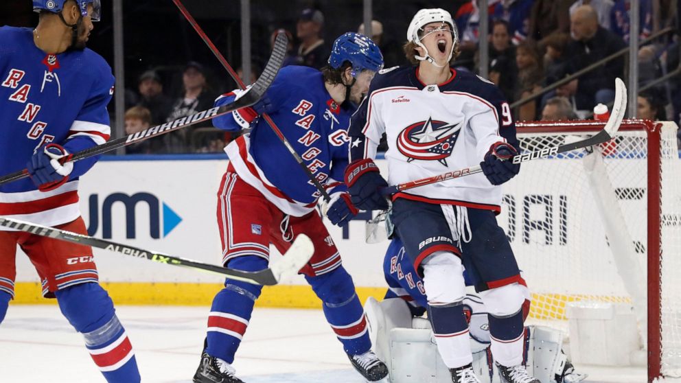 Columbus Blue Jackets center Kent Johnson (91) reacts after missing a shot on goal against the New York Rangers during the second period of an NHL hockey game, Sunday, Oct. 23, 2022, in New York. (AP Photo/Noah K. Murray)